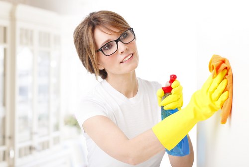 Experienced cleaners in W8 performing detailed household cleaning
